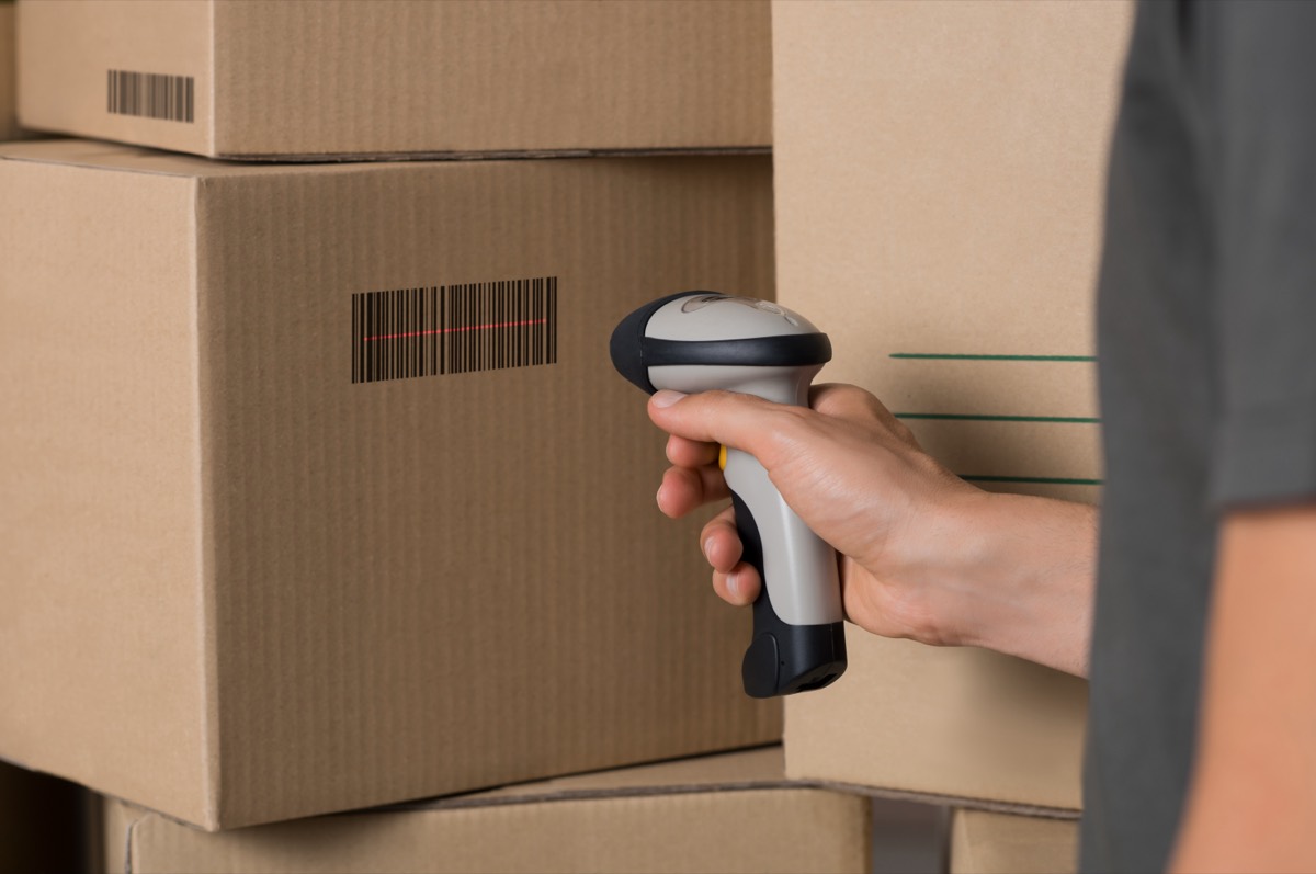 A document being scanned with a barcode overlay on a multifunction office printer