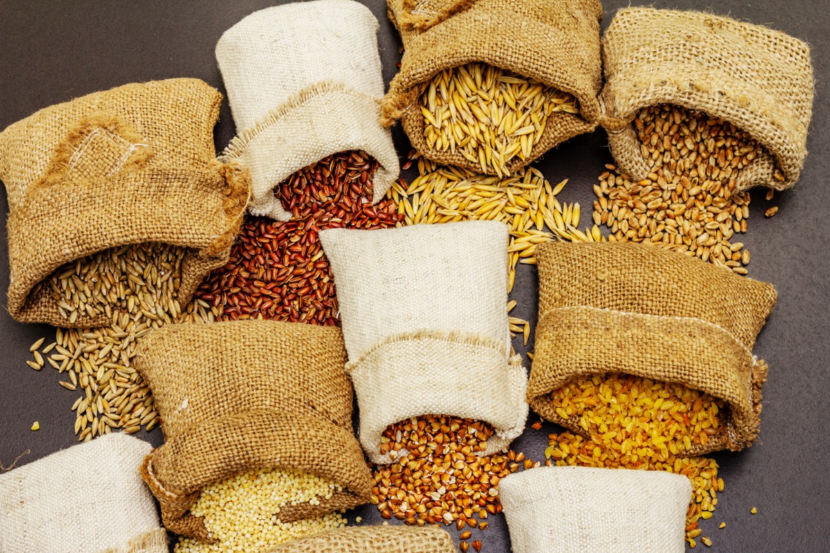 Burlap sacks of rice stacked in an export warehouse