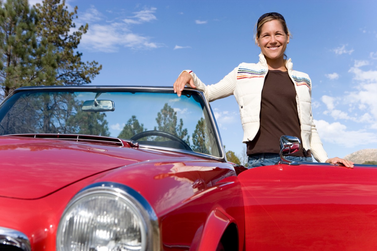 A vintage convertible car with its fabric top raised