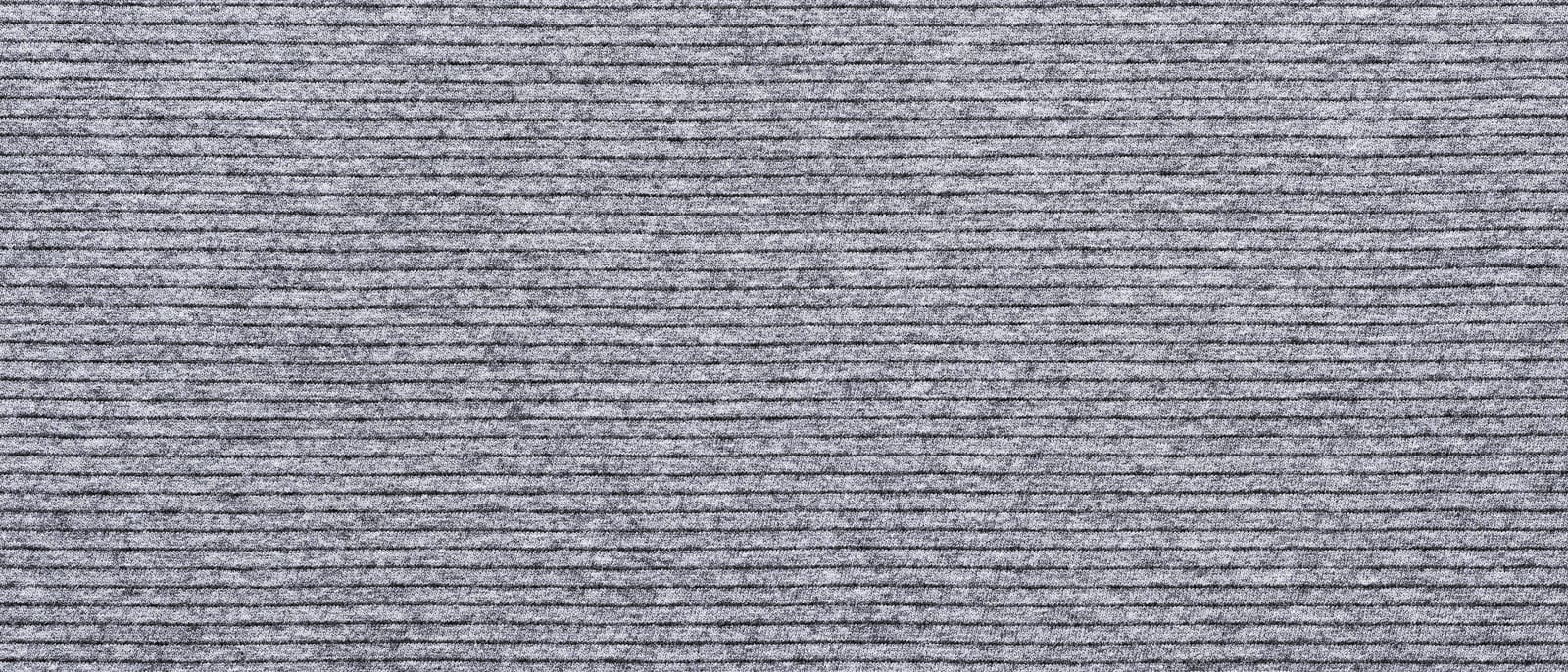 Close-up of wavy patterned reflective lining inside a winter glove and jacket
