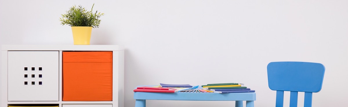 Open illustrated children's picture book lying on a wooden desk