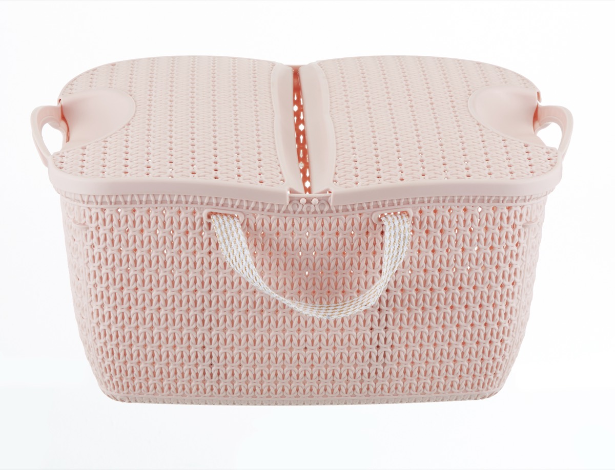 A woven plastic storage basket with an interlaced surface pattern