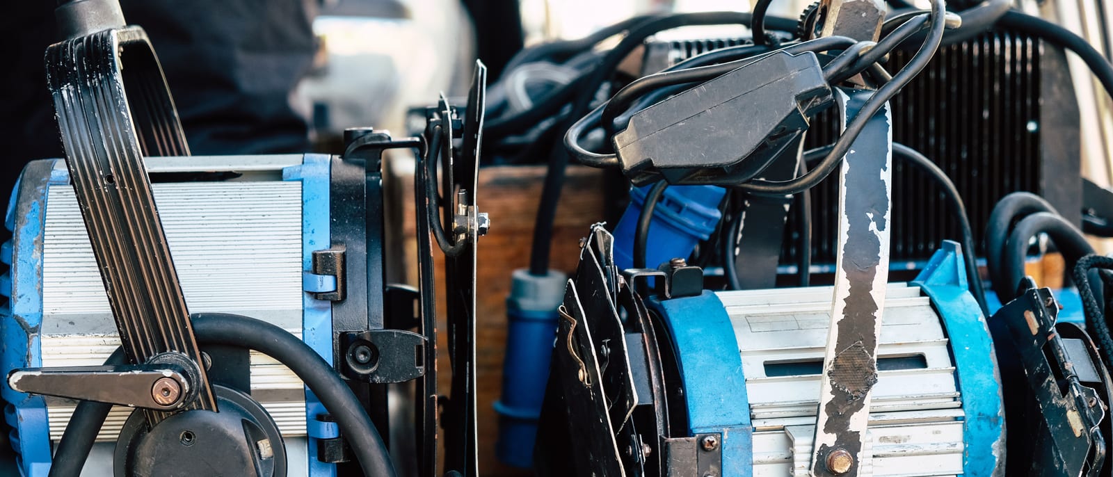 A film studio backlot soundstage with bright production lighting and rigging