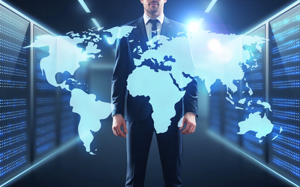 A world map overlaid on rows of data-center servers representing cross-border software access