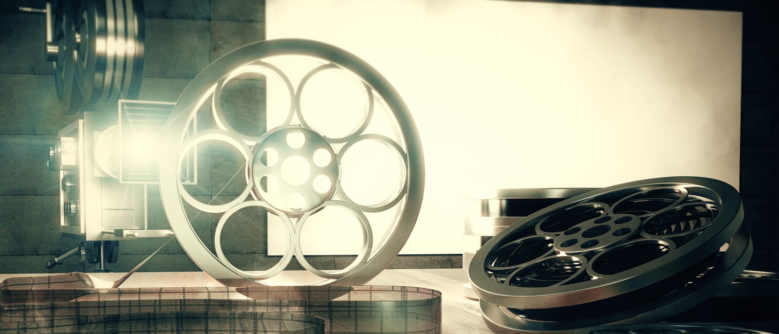 Vintage film reels and an old movie projector in a dim archive