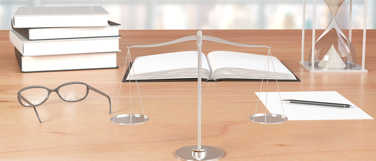 An old-fashioned balance scale resting on a wooden desk beside legal books