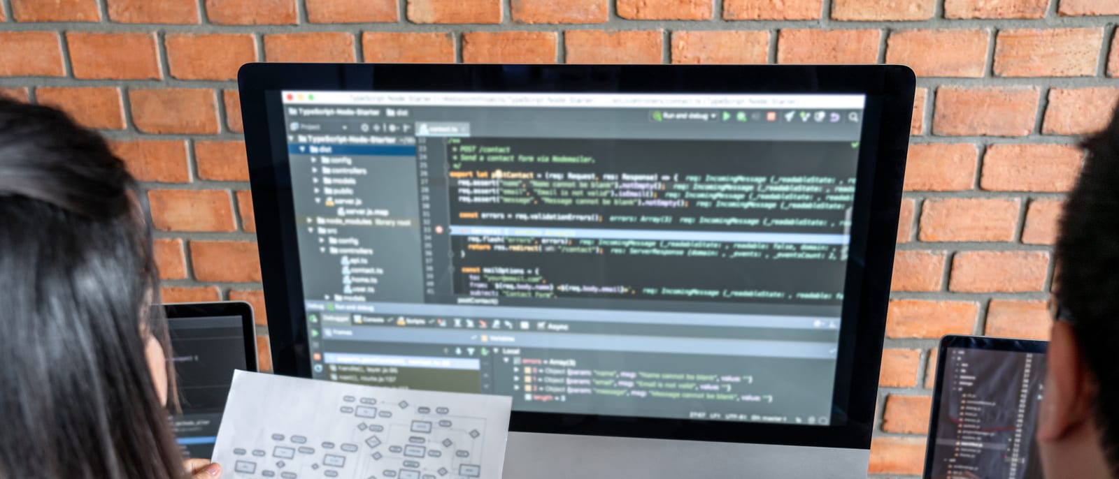 Lines of source code glowing on a dark developer monitor