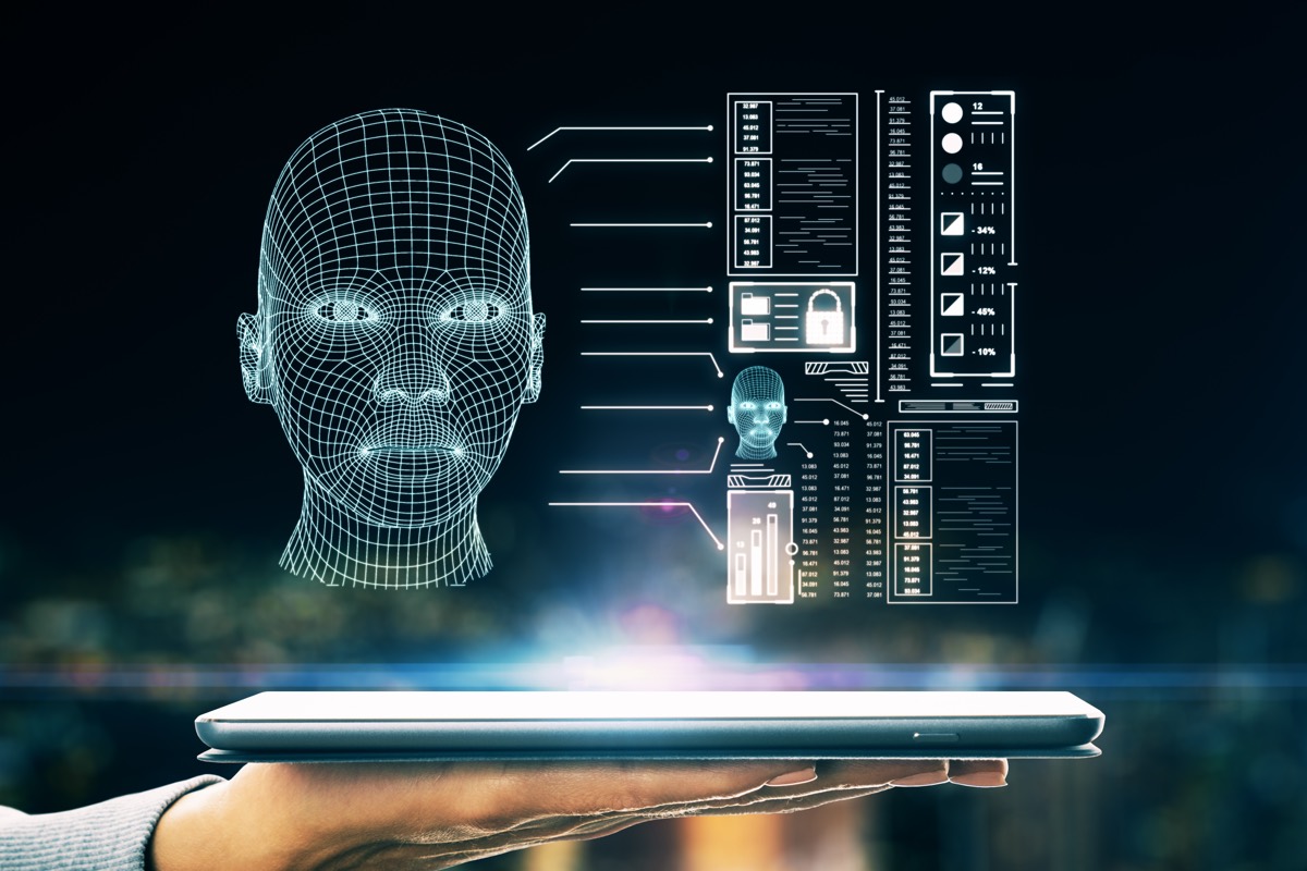 A face being digitally reconstructed on a computer screen from data points