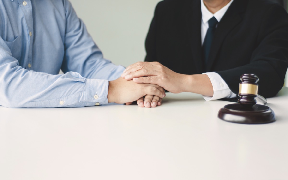 Founder and attorney reviewing an engagement letter across a conference table