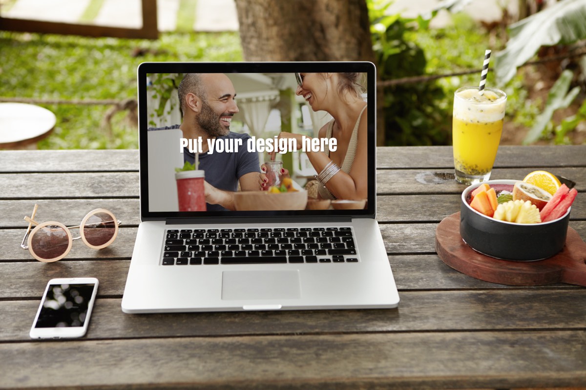 Creator registering a creative work on a laptop with documents nearby