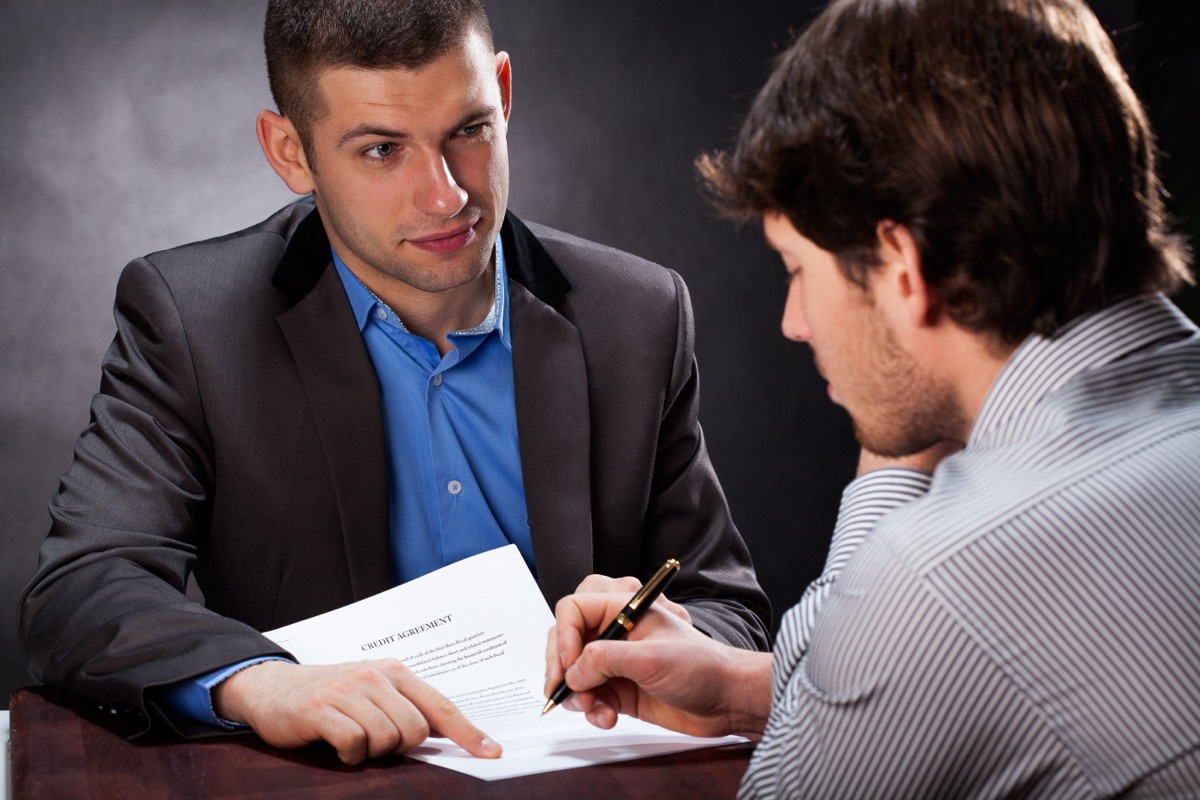 A lawyer highlighting a missing signature on an assignment agreement