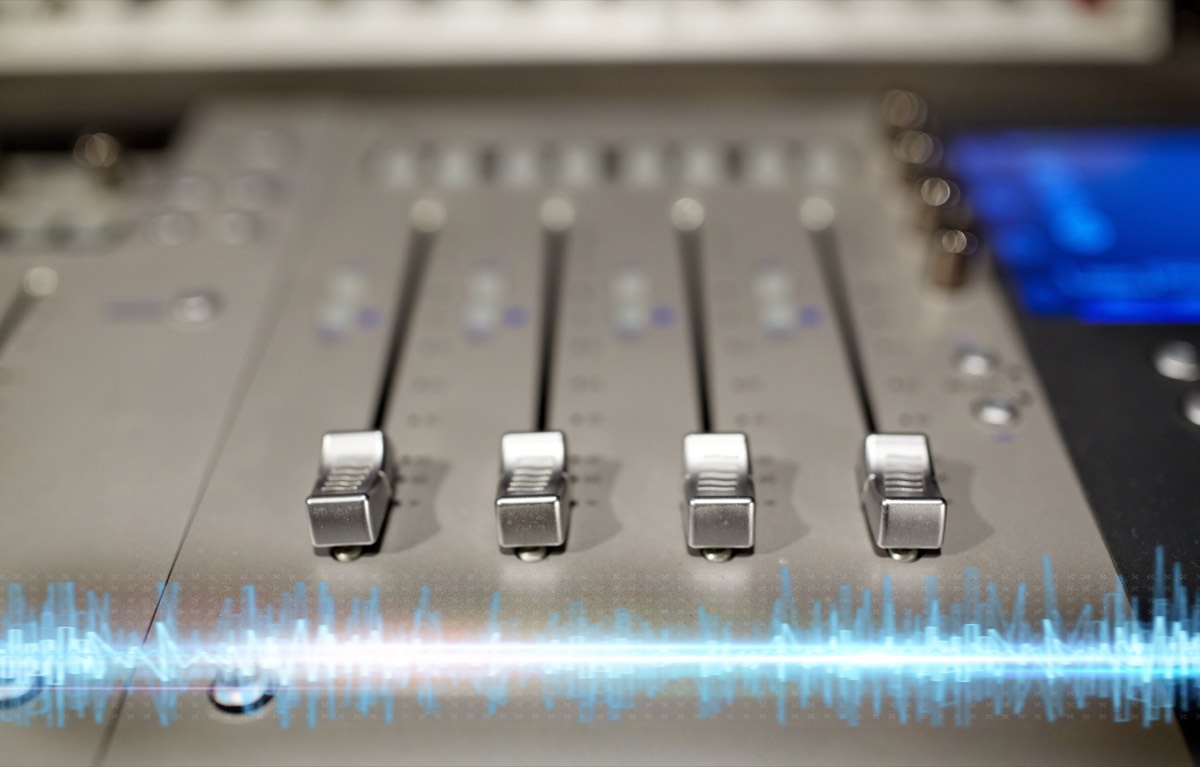 Recording studio mixing console with channel faders