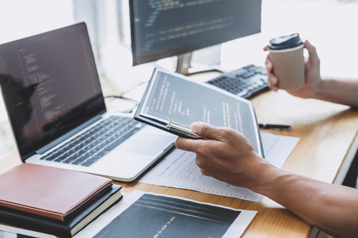 Software developer reviewing open-source code and license terms on a screen