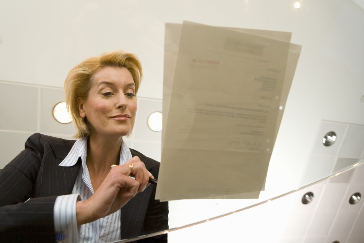 A confidential document folder locked in a safe inside a modern company office
