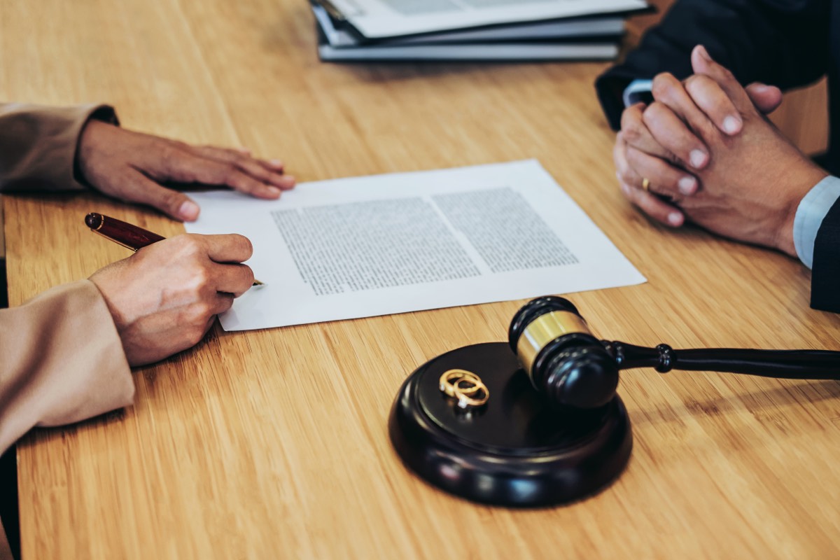 Domain dispute documents, a gavel, and a laptop on a desk