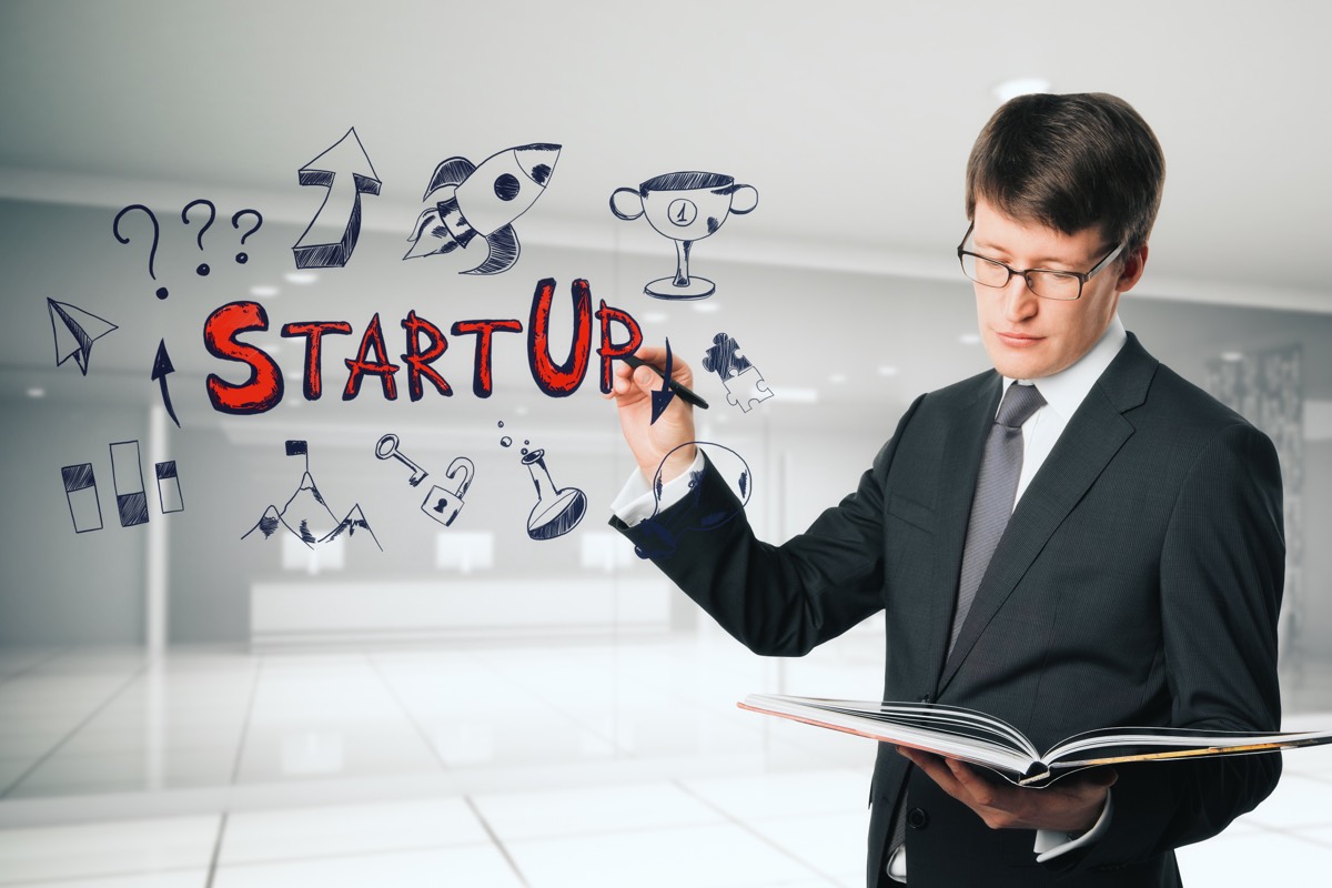 A startup founder reading a threatening legal letter with concern