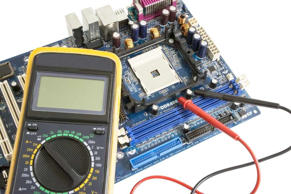 Macro photograph of surface-mounted components on a green electronic circuit board