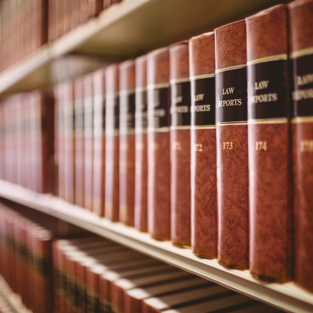 Bound volumes of law reports on a library shelf