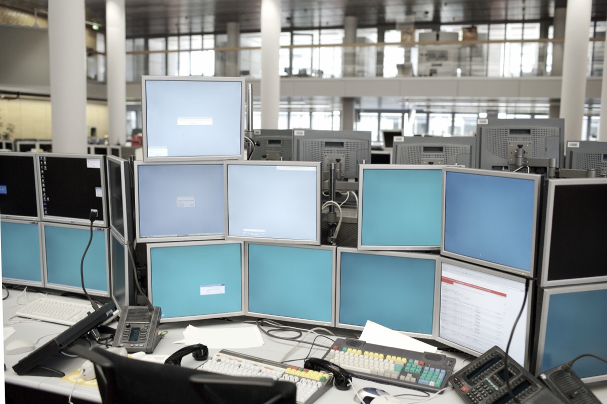 Rows of computer servers and financial trading terminals in a data center