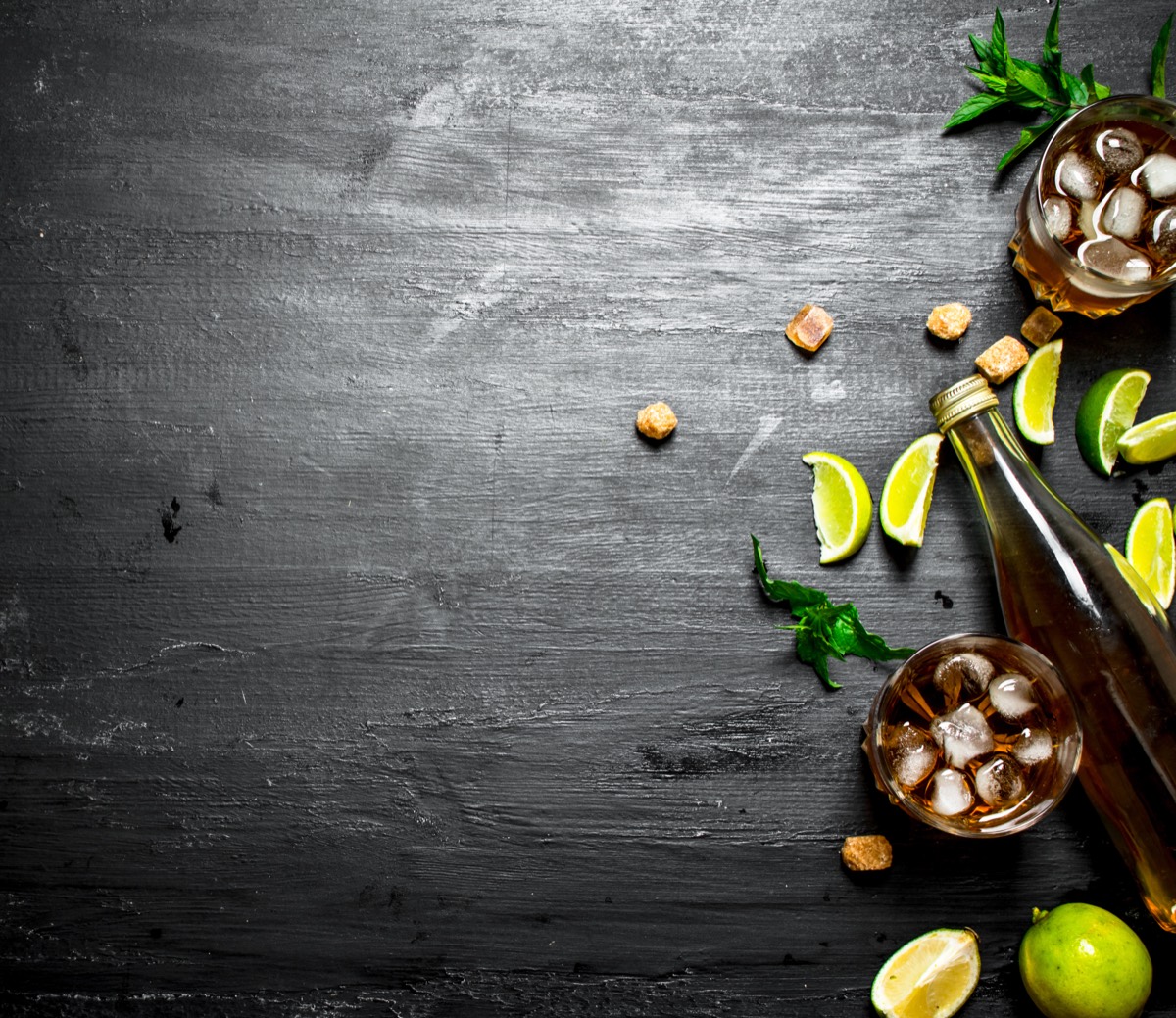 Bottles of rum on a backlit bar shelf