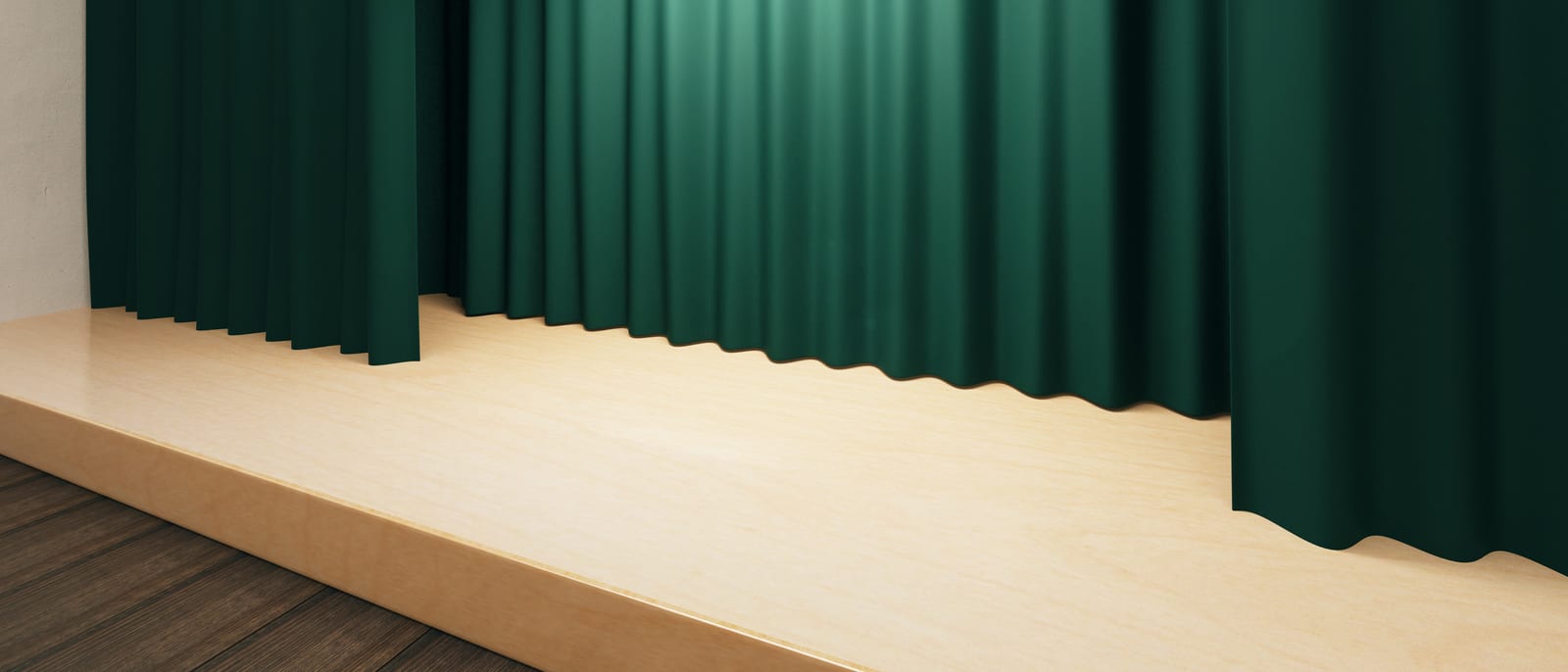 An empty comedy club stage with a single microphone under a spotlight
