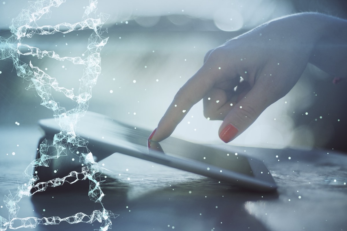 Laboratory technician analyzing genomic sequencing data on a monitor