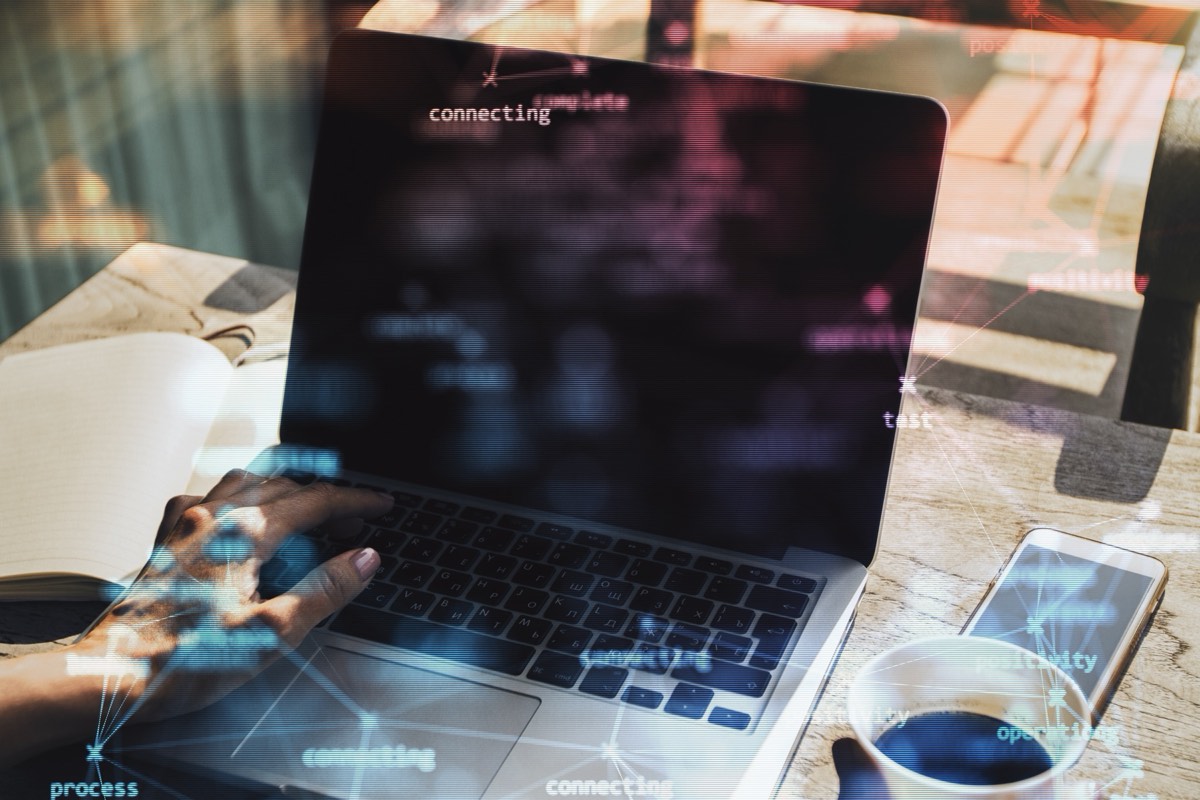 Wireless router and laptop illustrating Wi-Fi and video-codec standard-essential patents