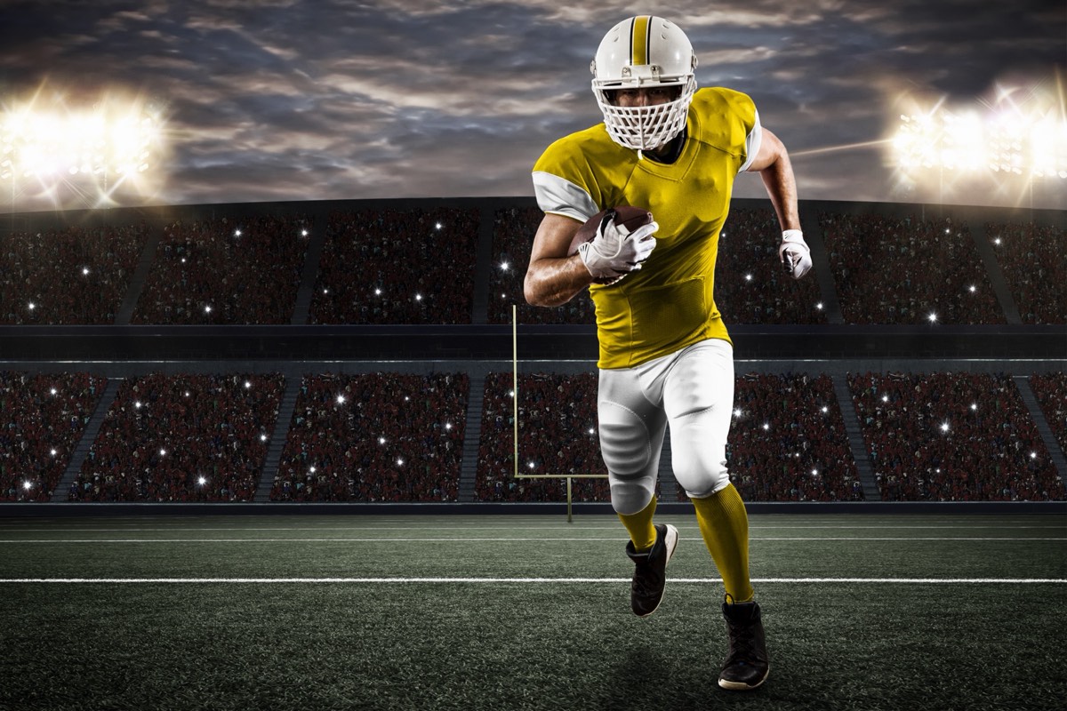 A football player's silhouette rendered as a digital avatar on a screen