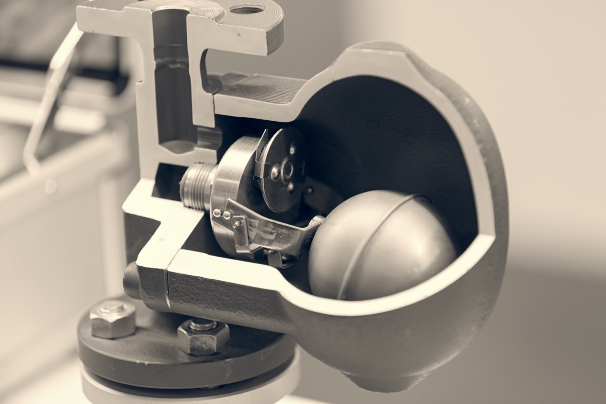 A mechanical actuator and valve assembly on an engineering workbench