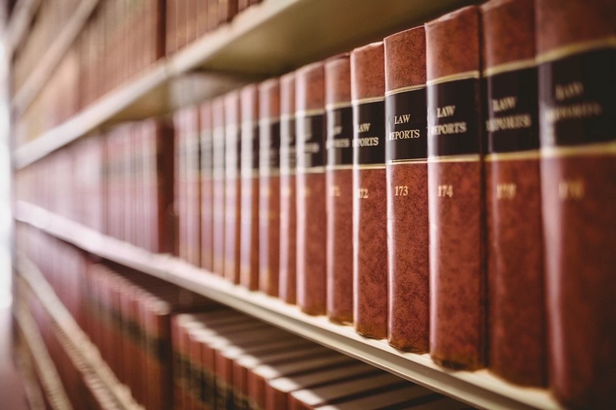 Rows of bound law reports on library shelves