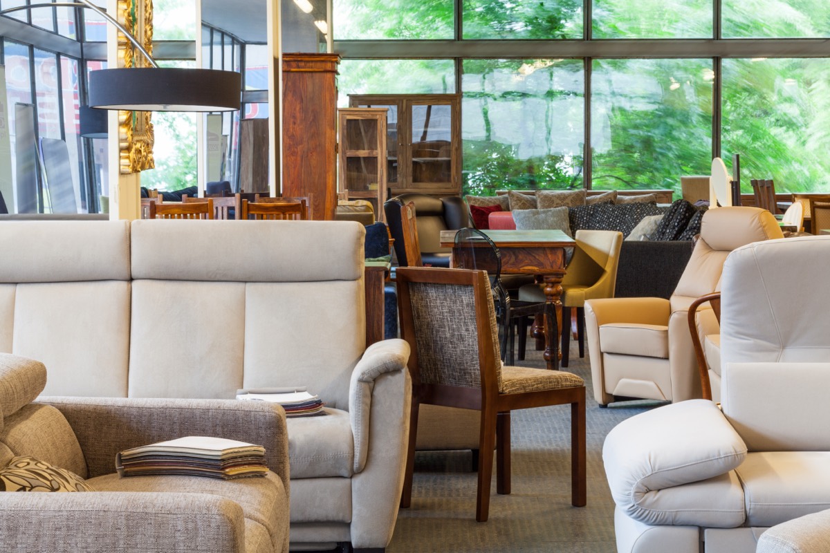 Leather sofas arranged on display in a furniture showroom