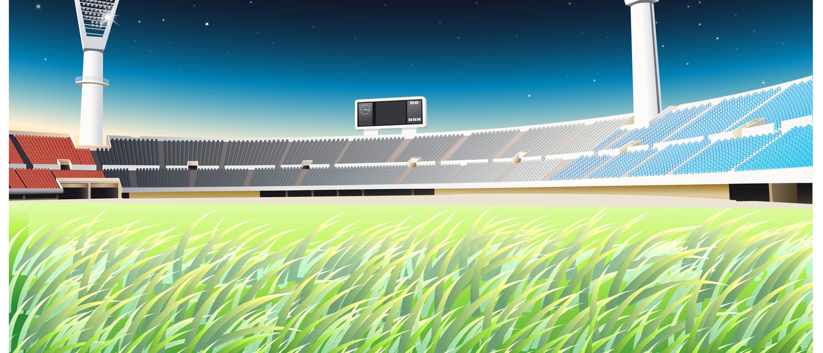An empty college football stadium at dusk with stadium lights on