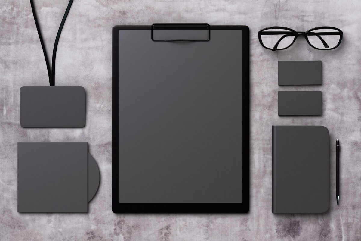 Press kit folders and marketing materials spread on a table