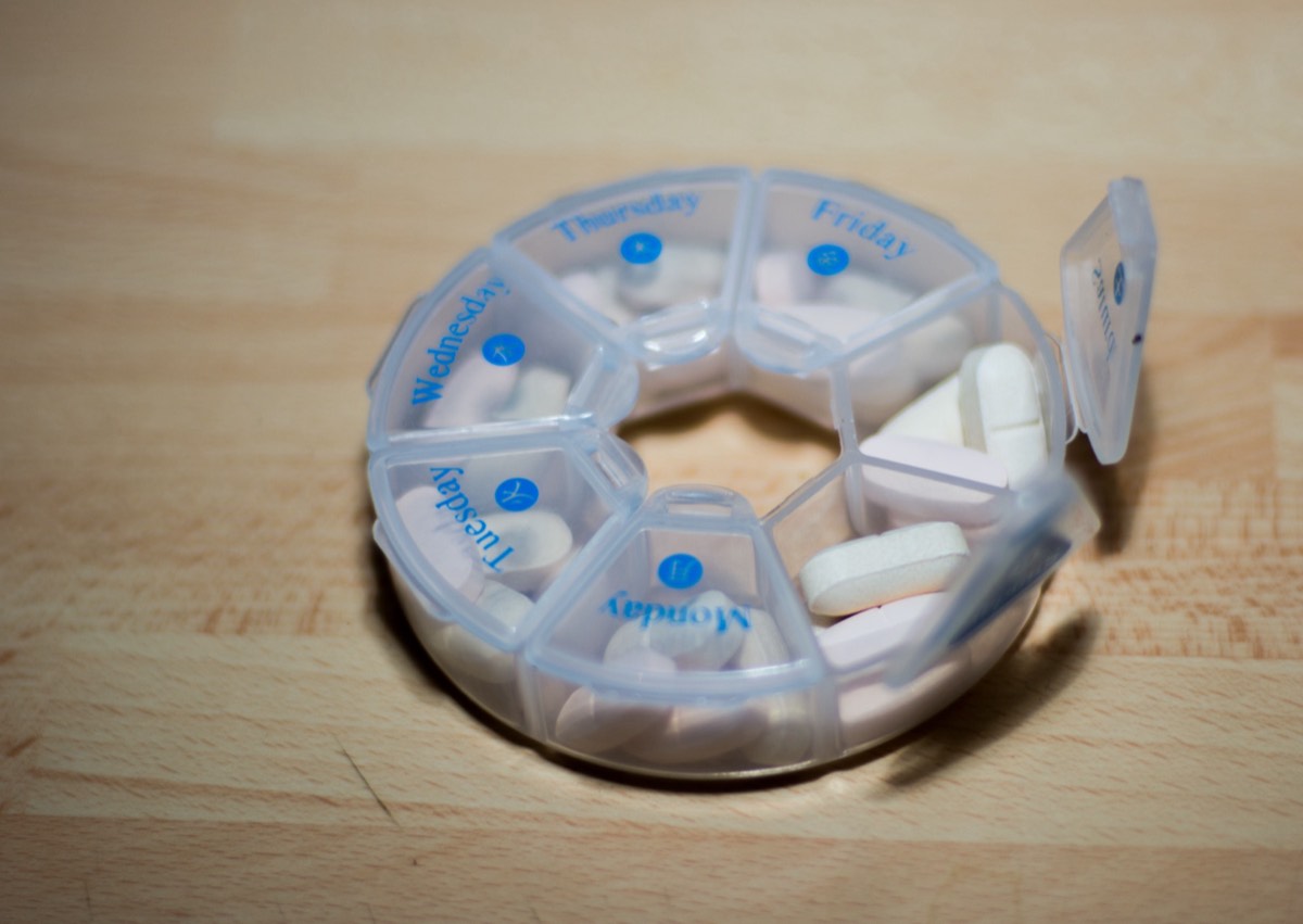 Pharmacy shelf with international pain-reliever packaging