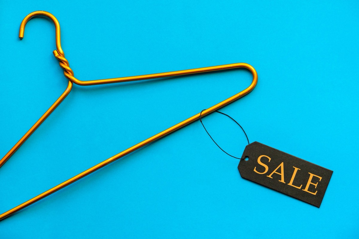 Athletic apparel hang tags bearing a licensed brand logo
