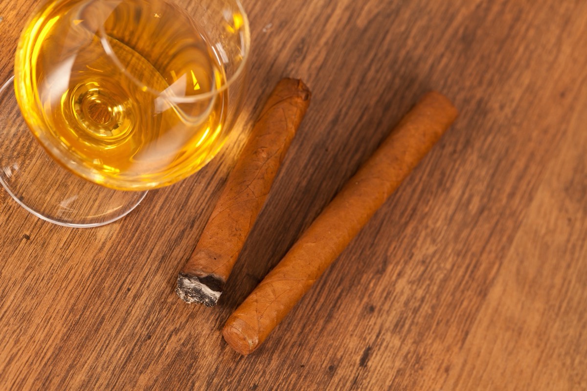 Premium cigars arranged on a wooden surface
