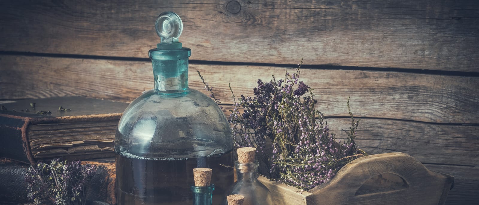 Antique apothecary shelves lined with labeled medicine bottles in an old pharmacy