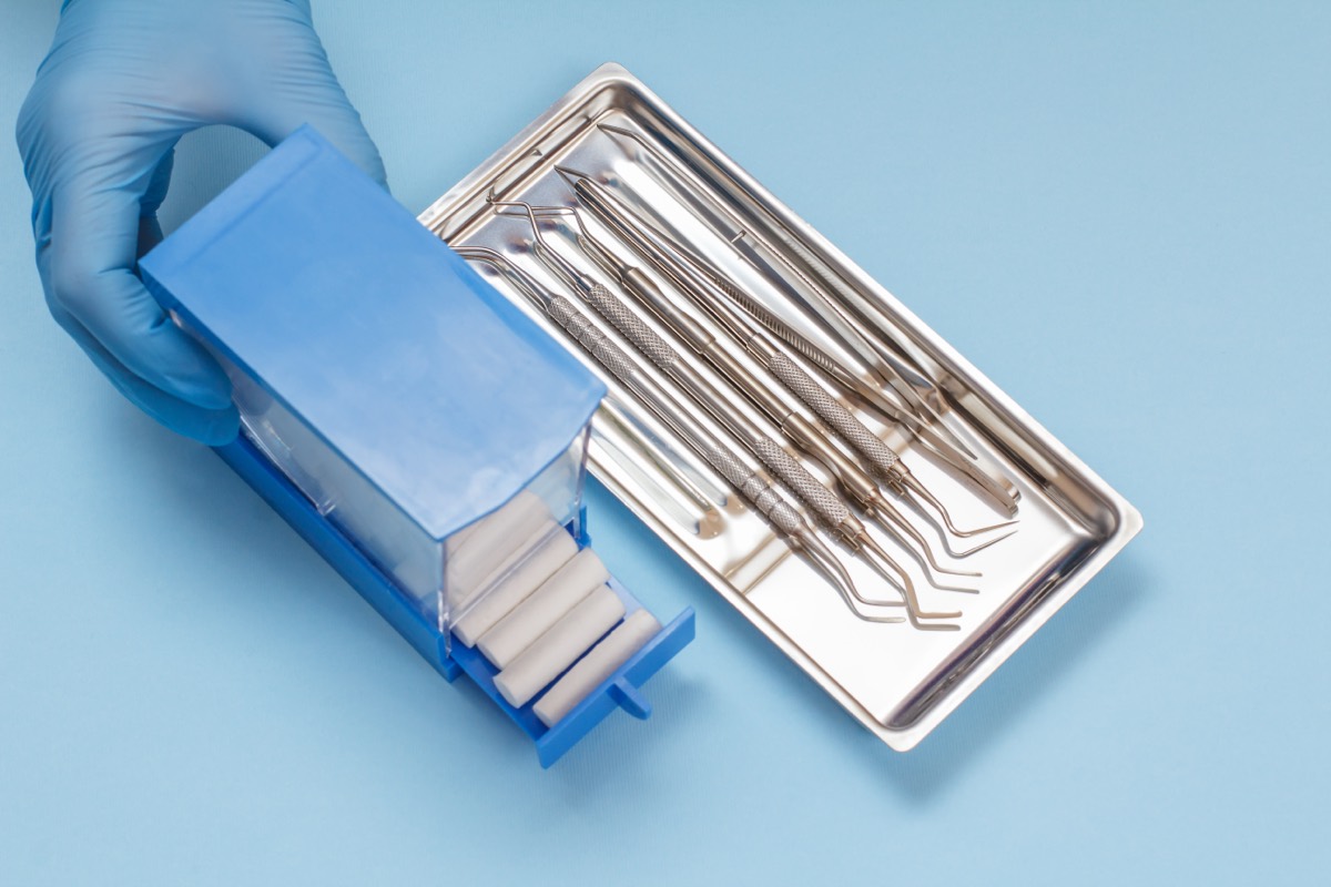 A coronary guide catheter used in interventional cardiology on a sterile tray
