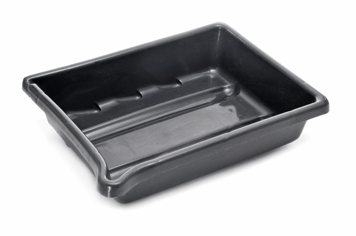 A molded rubber floor tray fitted inside a car footwell